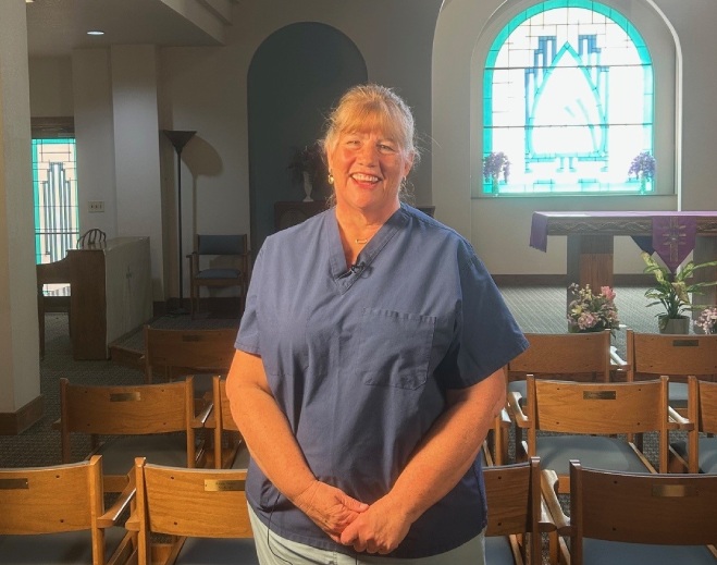 Person standing inside a church