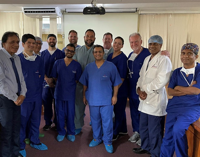 Group of clinicians standing together in room