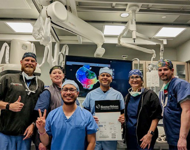 Surgical team holding certificate in operating room