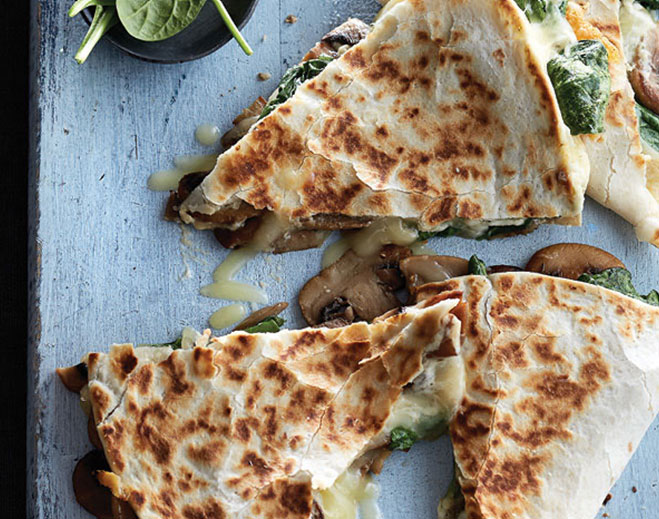 Mushroom quesadilla slices with melted cheese